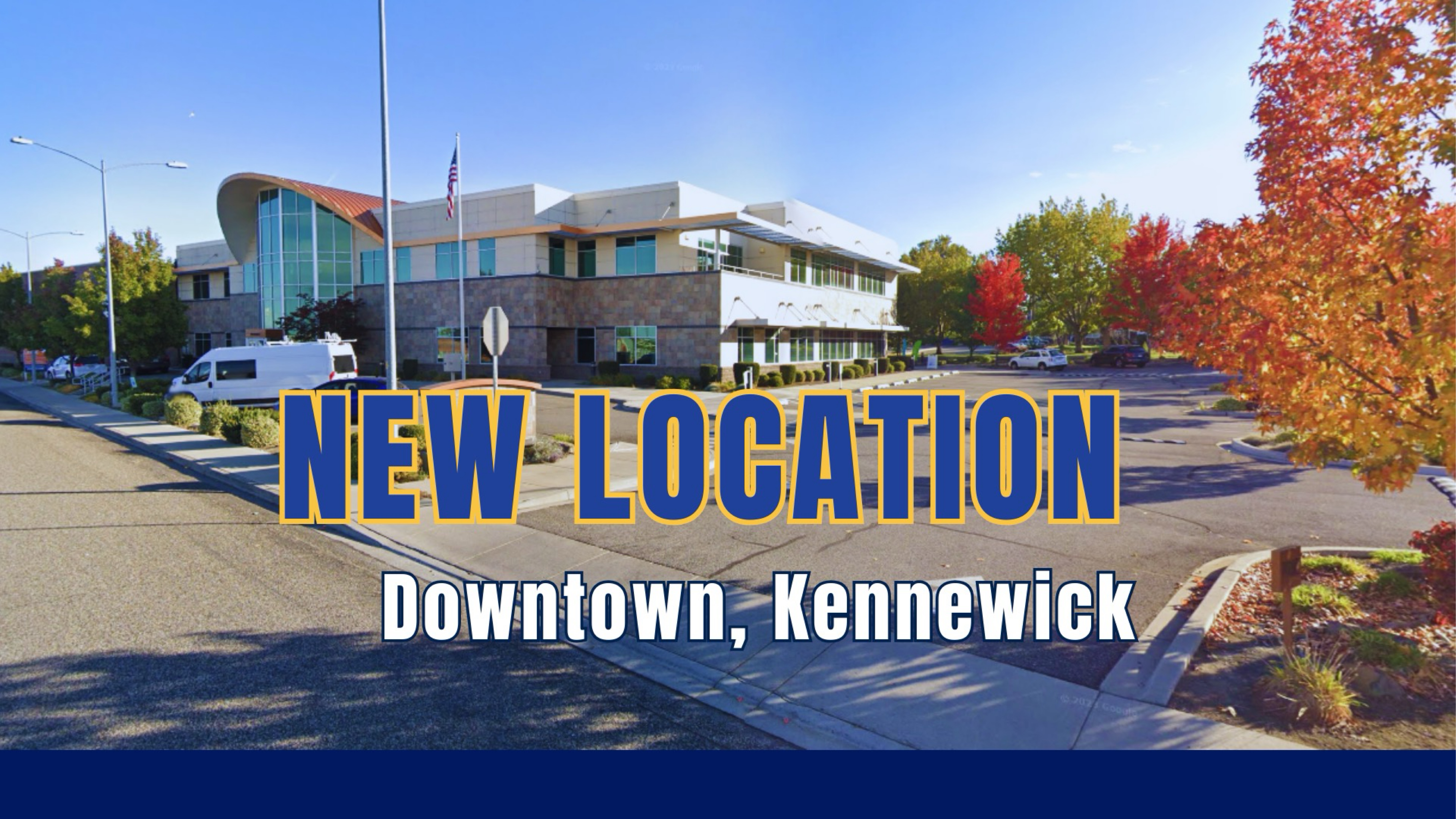 Building stands prominently in sunlight, surrounded by trees in autumn colors; text overlays read 'NEW LOCATION' and 'Downtown, Kennewick,' suggesting a recent relocation announcement.